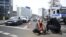 Police remove an activist of the environmental group 'Last Generation' (Letzte Generation) sitting on the ground to cause a traffic jam near Berlin's Ernst-Reuter-Platz central place during a climate action in Berlin, Germany, April 24, 2023.
