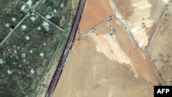 This handout satellite picture taken and released by Maxar Technologies on Feb. 15, 2024 shows machinery building a wall along the Egypt-Gaza Strip border in Rafah, Egypt. (©2024 Maxar Technologies)