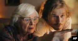 This image released by Magnolia Pictures shows June Squibb, left, and Fred Hechinger in a scene from the film "Thelma." (Magnolia Pictures via AP)