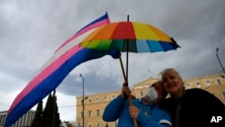 Same-sex marriage supporters take part in a rally at central Syntagma Square, in Athens, Greece, Feb. 15, 2024. Greece's parliament is to vote Thursday to legalize same-sex civil marriage unions, in a first for an Orthodox Christian country.