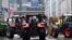 Tractors are stationed in front of the European Parliament during a protest called by farmers' organizations in response to the European Agriculture Council, in Brussels, on Feb. 26, 2024.