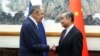 Menteri Luar Negeri Rusia Sergei Lavrov berjabat tangan dengan Menteri Luar Negeri China Wang Yi saat pertemuan di Beijing, China, 9 April 2024. (Kementerian Luar Negeri Rusia/Handout via REUTERS)
