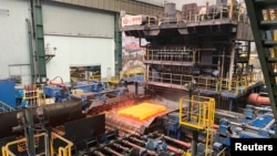 FILE - A steel billet is seen on a medium plate production line at a Baowu Group steel mill in Ezhou, Hubei province, China, June 21, 2023.