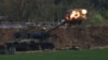 An Israeli mobile artillery unit fires a shell from southern Israel towards the Gaza Strip, in a position near the Israel-Gaza border, Feb. 22, 2024. 