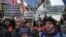 FILE - Protesters hold placards reading 'Not an accident, but a massacre - change the mining law in favor of workers' in front of Calik Holding, in Istanbul on Feb. 14, 2024.