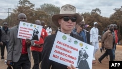 FILE - Religious leaders carry anti-LGBTQ placards as they lead nationwide marches against same-sex marriage in Lilongwe, Malawi, July 13, 2023. A Malawi court on June 28, 2024, dismissed a bid for the legalization of same-sex relationships.
