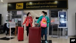 FILE - Chinese tourists arrive at Chiang Mai international airport in Chiang Mai province in northern Thailand, January 23, 2023. (AP Photo/Wichai Thaprieo)