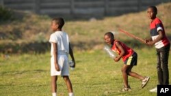 Children play cricket using plastic bottles and sticks at Takashinga Cricket Club in Highfields, June, 18, 2023.