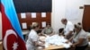 Members of an election commission count ballots at a polling station after a snap election in the Milli Mejlis parliament in Baku, Azerbaijan, Sept. 1, 2024.