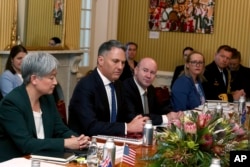 Australia's Defense Minister Richard Marles, second from left, addresses U.S. Secretary of State Antony Blinken and U.S. Secretary of Defense Lloyd Austin as Australia's Foreign Minister Penny Wong, left, looks on during discussions at Queensland Government House in Brisbane, Australia, on July 29, 2023.