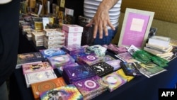 FILE - Tarot card are displayed during the 5th International Tarot Congress in Rosario, Argentina, on Nov. 11, 2023.