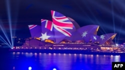FILE - This picture shows the Opera House illuminated in the colors of the Australian flag in Sydney on Australia Day on Jan. 26, 2023. 