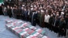 Iranian Supreme Leader Ayatollah Ali Khamenei, center with black turban, leads a prayer over the flag-draped coffins of the Revolutionary Guards members who were killed in an Israeli airstrike in Syria, in Tehran, April 4, 2024. (Office of Iran's Supreme Leader via AP)
