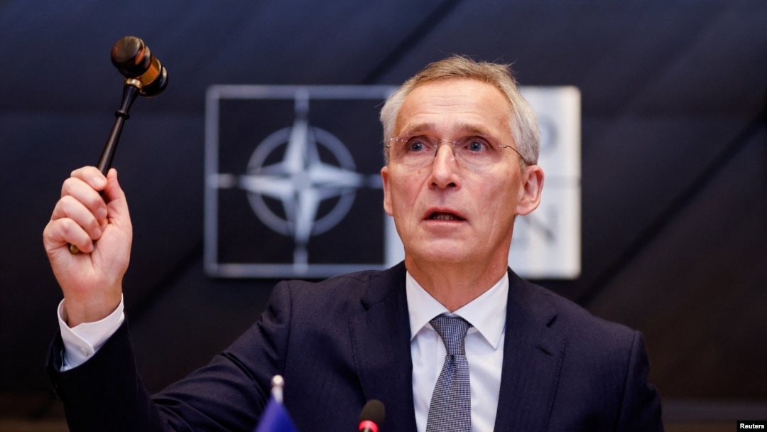 NATO Secretary General Jens Stoltenberg holds a gavel as he attends a meeting of the North Atlantic Council in the NATO defense ministers' session at the Alliance's headquarters in Brussels, Belgium, Feb. 15, 2024.