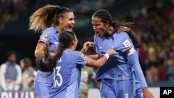 France's Wendie Renard, right, celebrates after scoring her team's second goal in the Women's World Cup Group F match between France and Brazil, Brisbane, Australia,, July 29, 2023.