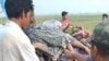 Bodies are piled on a cart after being discovered in Nyaung Yin village, Myinmu township in the Sagaing region, central Myanmar on March 2, 2023.
