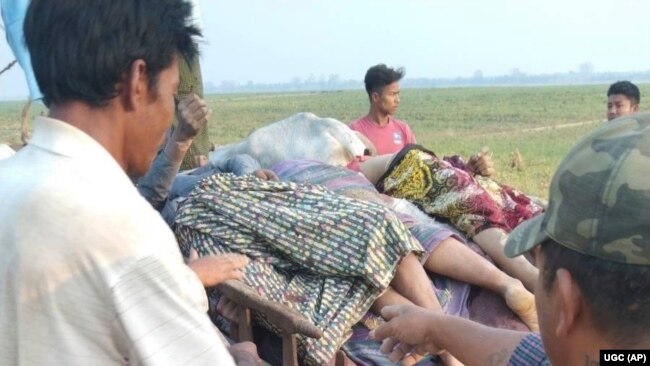Bodies are piled on a cart after being discovered in Nyaung Yin village, Myinmu township in the Sagaing region, central Myanmar on March 2, 2023.