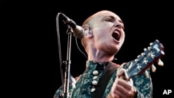 FILE - Irish singer-songwriter Sinead O'Connor performs on the first night of the Toender Folk Music Festival in Toender, Denmark, Aug. 23, 2013. O’Connor has died at 56, her family said July 26, 2023. 
