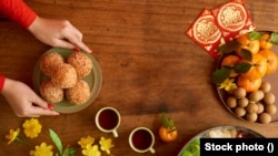 During the Chinese New Year, eating citrus and other round objects is believed to bring prosperity in the new year.