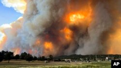 In this photo provided by Pam Bonner, smoke rises from fires in Ruidoso, New Mexico, June 17, 2024.