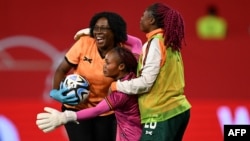 FILE - Zambia's goalkeeper Catherine Musonda (C) celebrates with her team after winning the International friendly football match Germany vs Zambia in Fuerth, southern Germany, on July 7, 2023, ahead of the FIFA Women's World Cup.