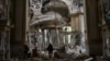 Church personnel inspect damage inside the Spaso-Preobrazhensky (Lord's Transfiguration) Cathedral in Odesa, Ukraine, July 23, 2023, following Russian missile attacks.