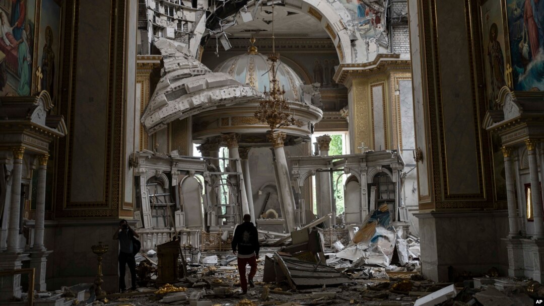 Church personnel inspect damage inside the Spaso-Preobrazhensky (Lord's Transfiguration) Cathedral in Odesa, Ukraine, July 23, 2023, following Russian missile attacks.