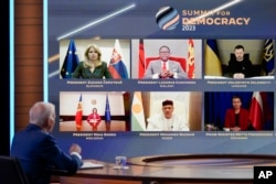 World leaders attend virtually as President Joe Biden speaks during a Summit for Democracy virtual plenary in the South Court Auditorium on the White House campus, in Washington, March 29, 2023.