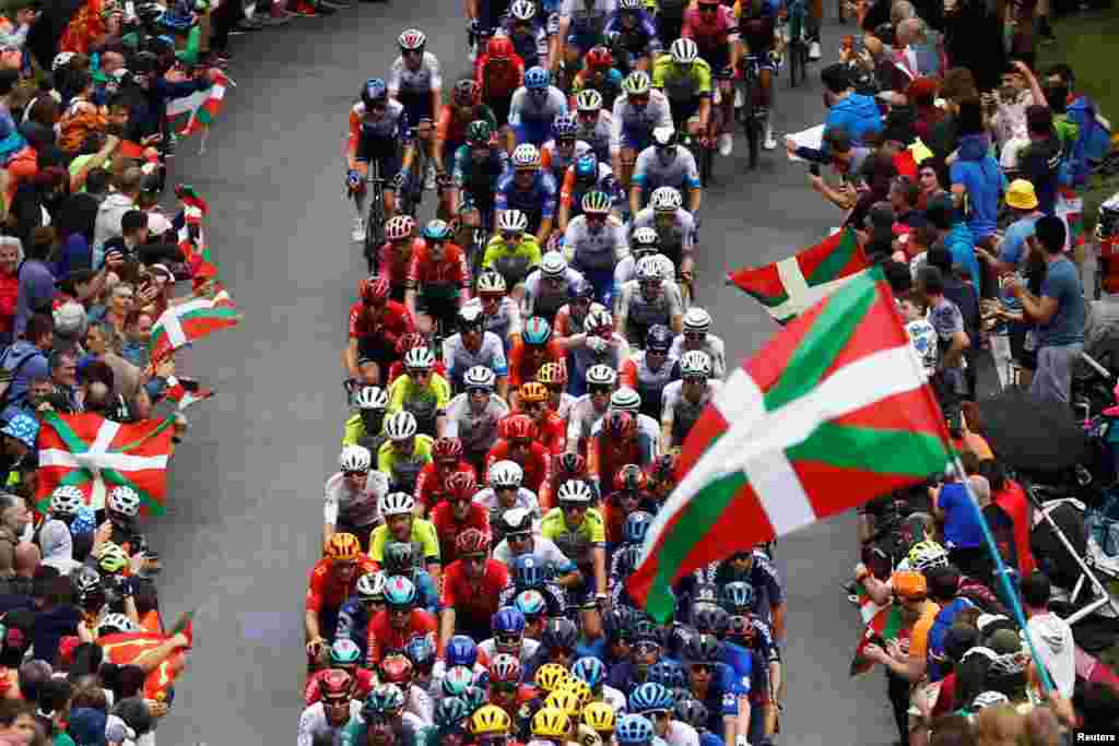 The peloton competes during stage 2of the Tour de France cycling race over 209 kilometers (130 miles) with start in Vitoria Gasteiz and finish in San Sebastian, Spain.