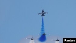 South Korean Air Force&#39;s Black Eagles aerobatic team performs during an aerial display at the Singapore Airshow at Changi Exhibition Centre, in Singapore.