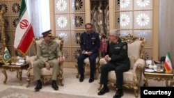 General Hossein Bagheri, the chief of staff of Iran’s armed forces, right, meets with his Pakistani counterpart, General Asim Munir, left, in Tehran, July 15, 2023. (Courtesy Pakistan army via Ayaz Gul)