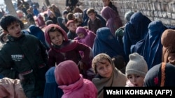FILE - Afghan women and children refugees deported from Pakistan are pictured at the United Nations High Commissioner for Refugees camp on the outskirts of Kabul, Jan. 9, 2024.