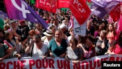 Women march protesting against the French far-right National Rally party, ahead of upcoming French parliamentary elections, in Paris, June 23, 2024.