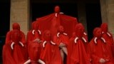 People covered in red fabric, the color of San Fermin festival, protest against animal cruelty before the start of the San Fermin festival, in Pamplona, northern Spain, Pamplona, northern Spain, July 5, 2023.