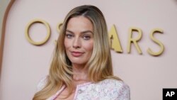 Margot Robbie arrives at the 96th Academy Awards Oscar nominees luncheon at the Beverly Hilton Hotel in Beverly Hills, California, Feb. 12, 2024.