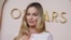Margot Robbie arrives at the 96th Academy Awards Oscar nominees luncheon at the Beverly Hilton Hotel in Beverly Hills, California, Feb. 12, 2024.