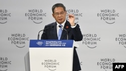 Chinese Premier Li Qiang speaks during the opening of the "Summer Davos" World Economic Forum in Dalian, in China's northeastern Liaoning province, June 25, 2024. 