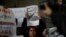 FILE - A woman holds the picture of Mexican journalist Luis Martin Sanchez, whose body was found on the outskirts of the city of Tepic, during a protest on July 10, 2023, to demand justice for him, outside the Interior Ministry building in Mexico City.