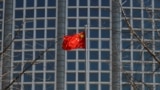 A Chinese flag flutters in Beijing, Feb. 24, 2022. Chinese state media reported on May 18, 2024, that the head of China's Ministry of Agriculture and Rural Affairs is being investigated on charges of corruption.
