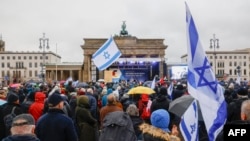 People take part in a demonstration against anti-Semitism on Dec. 10, 2023 at Brandenburger Gate in Berlin.