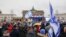 People take part in a demonstration against anti-Semitism on Dec. 10, 2023 at Brandenburger Gate in Berlin.