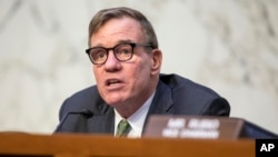 FILE - Chairman Mark Warner speaks during a Senate Intelligence Committee hearing to examine worldwide threats at the Capitol in Washington, March 8, 2023. 