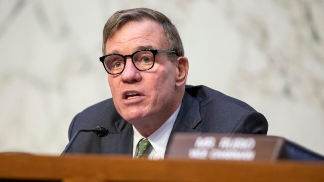 FILE - Chairman Mark Warner speaks during a Senate Intelligence Committee hearing to examine worldwide threats at the Capitol in Washington, March 8, 2023.