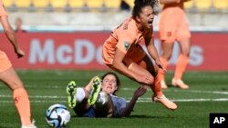 Netherlands' Lieke Martens, right, reacts after a tackle from behind by the United States' Andi Sullivan during the Women's World Cup Group E soccer match between the United States and the Netherlands in Wellington, New Zealand, July 27, 2023.