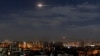 FILE - In this photo released by the Syrian official news agency SANA, shows missiles flying in the sky near Damascus International Airport, in Damascus, Syria, Jan. 21, 2019.