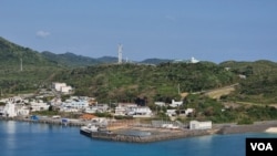 A military installation towers above the main fishing port in Yonaguni, which is gradually becoming an outpost in the defense of Japan. (W.Gallo/VOA)