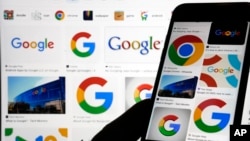 In this file photo, various Google logos are displayed on a Google search, Monday, Sept. 11, 2023, in New York. (AP Photo/Richard Drew, File)