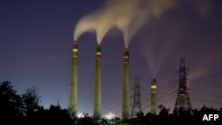 Smoke rises from the chimneys of the Suralaya coal-fired power plant in Cilegon on Sept. 14, 2023.