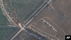 This satellite image provided by Maxar Technologies shows fortifications and dragons in Medvedivka, Crimea, Feb. 11, 2023.