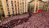 A music band plays in the town hall square after the 'Chupinazo' rocket, to mark the official opening of the 2023 San Fermín fiestas in Pamplona, Spain, July 6, 2023. 
